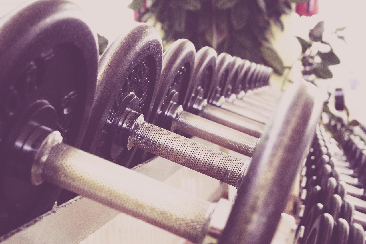 Fitness, dumbbells, training — The Ultimate Stress Relief for Business Travelers through Massage